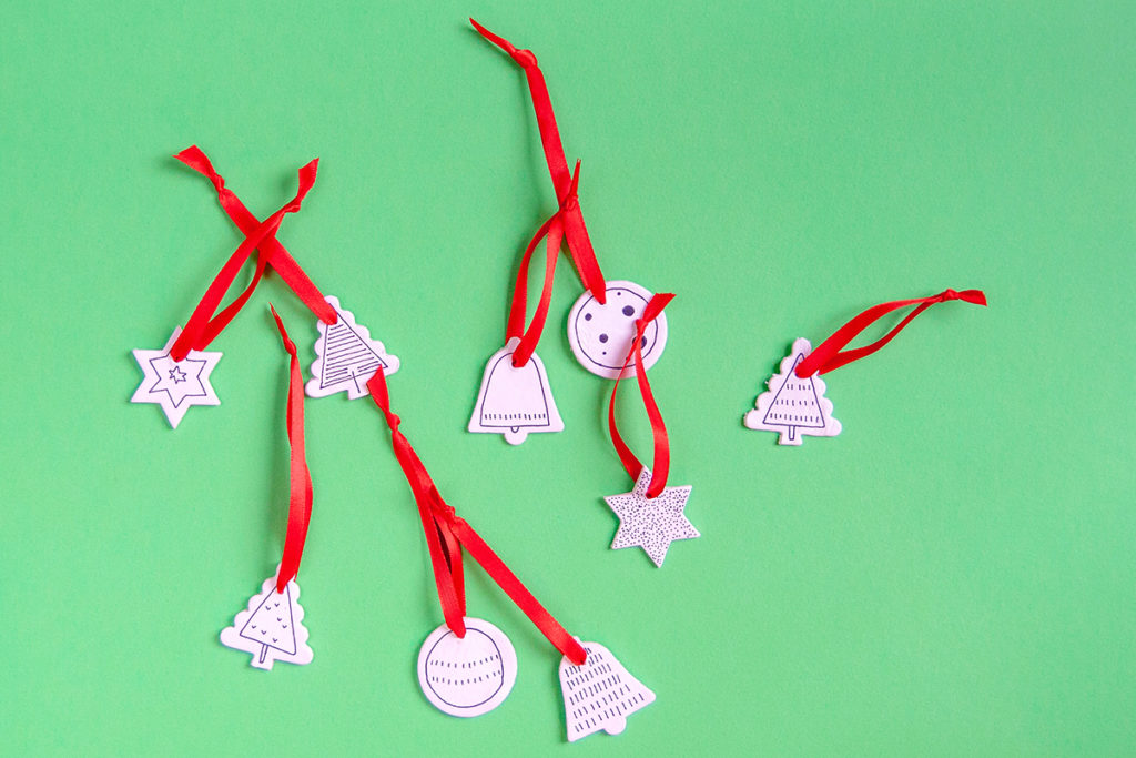 White Clay Christmas Ornaments - DIY - Lovely ornaments made of white modeling clay and decorated with a sharpie. Super simple! - www.yeswemadethis.com