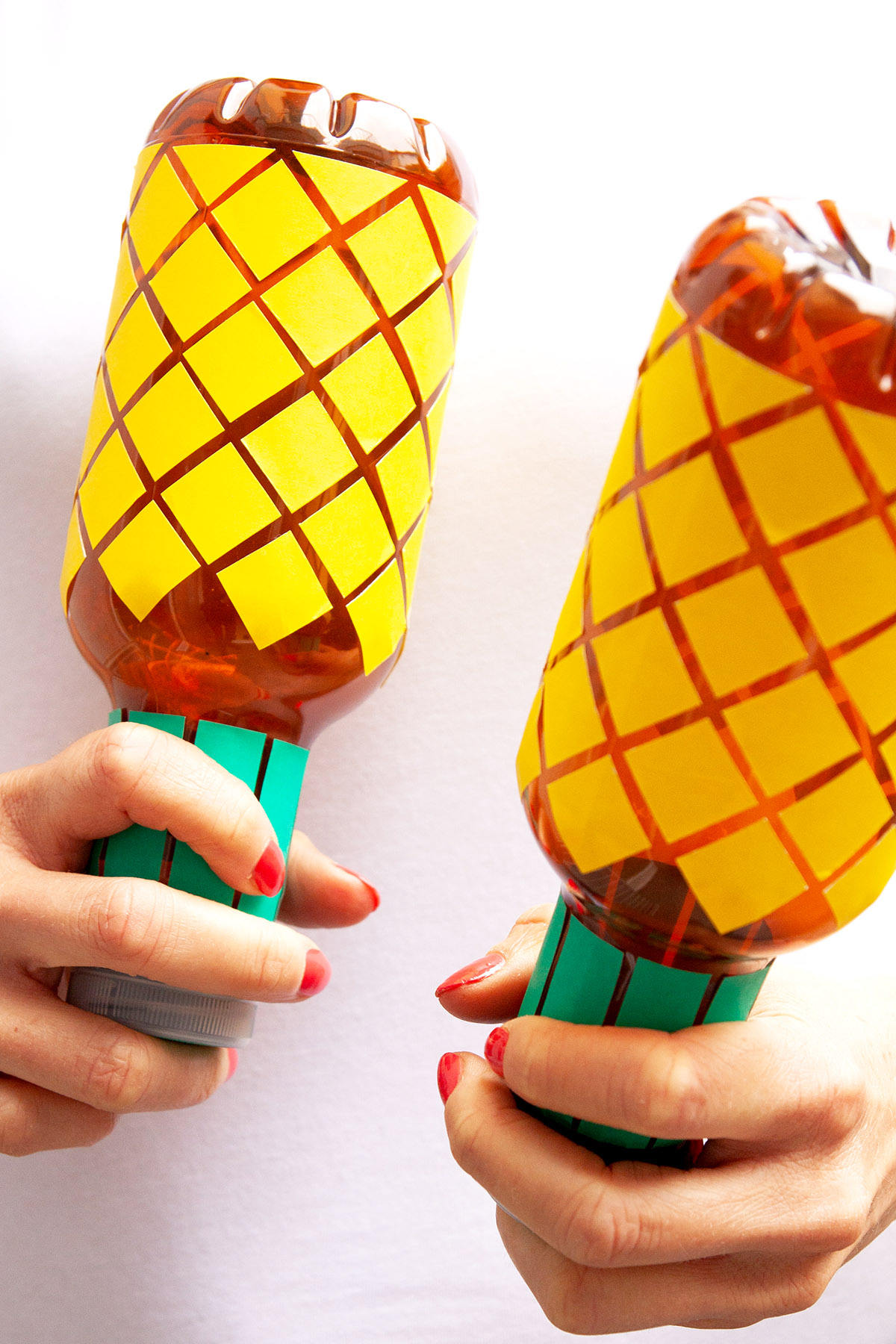 DIY Pineapple Maracas - Learn how to make these fun maracas out of plastic bottles. - www.yeswemadethis.com